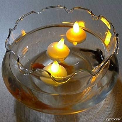 The Decor Affair "Twinkling Waterscape Lights: Create a Mesmerizing Ambiance with 24 Flameless Tealight Floaters for Ponds, Pools, and More