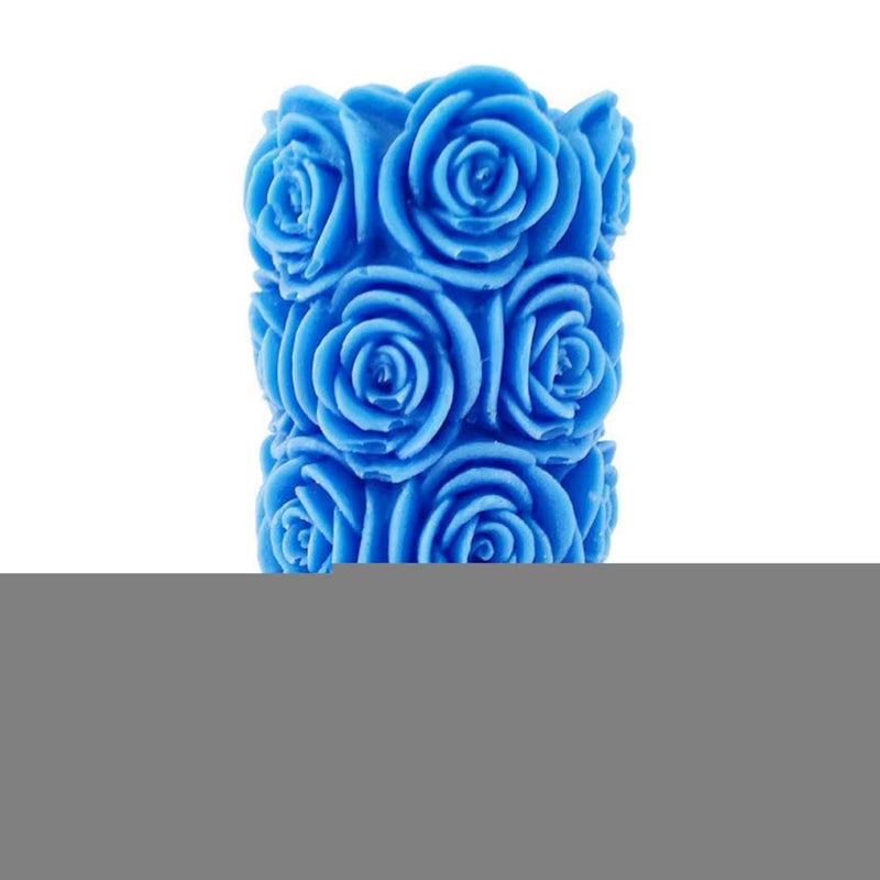 The Decor Affair 1 Pcs Aroma of Royal Azure Serenity Embrace Your Space, as The Intricately Designed Blue Rose Pillar Scented Candle Whispers Tales of Floral Fantasy, Creating a Relaxing Atmosphere.