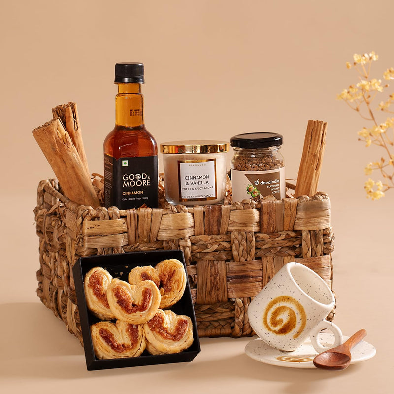 The Knot Company Cinnamon Collection Gift Set of 7 Assorted Items | Cinnamon Candle, Sticks, Syrup, Cookies, Hazelnut Cinnamon Coffee, Cup & Saucer and Wooden Spoon